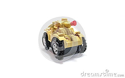 Yellow toy tank isolatedâ€‹ onâ€‹ whiteâ€‹ background.â€‹ Receptive Language forâ€‹ kid. Stock Photo